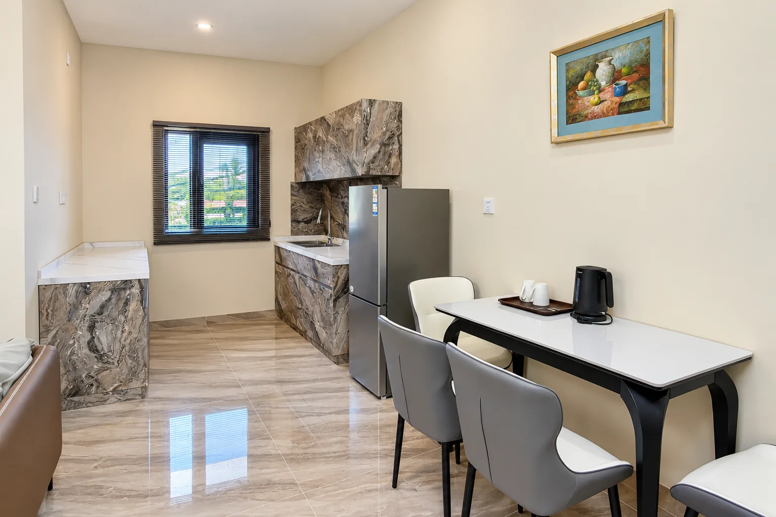 Two-Bedroom Apartment — dining table beside the kitchen